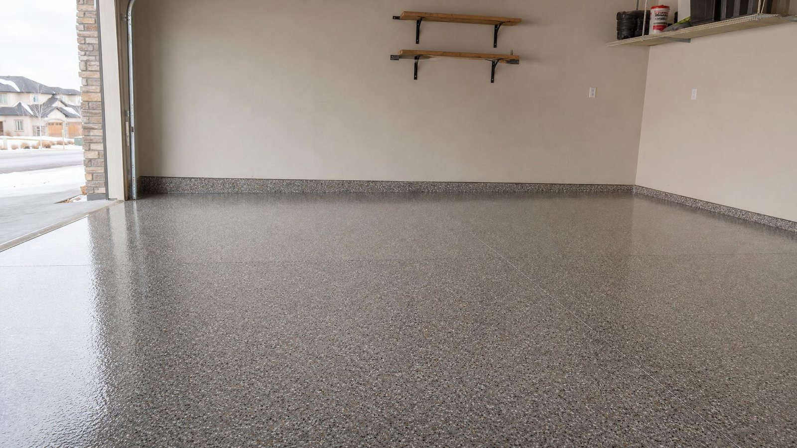 Gray decorative flake epoxy coating on a residential garage floor