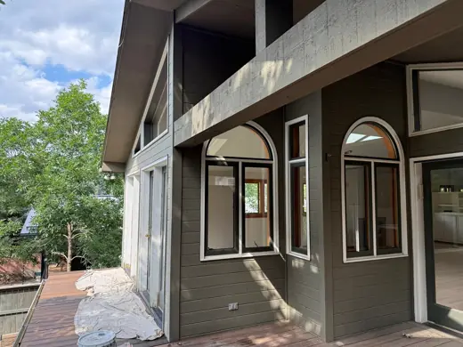 Arched window entry with stucco and brown trim, Elements Painting project on the Colorado Front Range