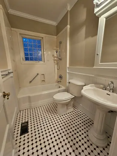 Bathroom with gray walls and black-white checkered tile, Elements Painting project on the Colorado Front Range