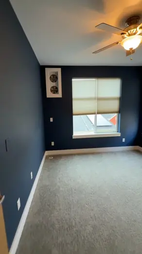 Bedroom with dark navy walls and carpet, Elements Painting project on the Colorado Front Range
