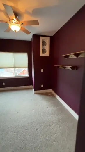 Bedroom with deep burgundy walls and carpet, Elements Painting project on the Colorado Front Range