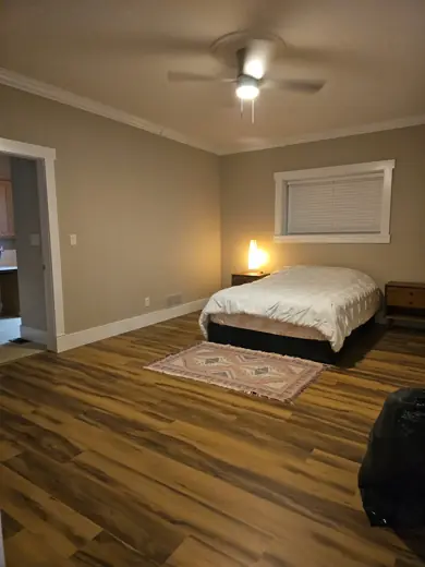 Bedroom with gray-green walls and wood floors, Elements Painting project on the Colorado Front Range