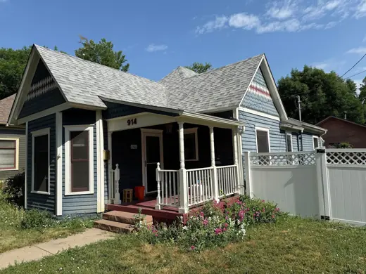 Blue Victorian cottage with white trim and red steps, Elements Painting project on the Colorado Front Range