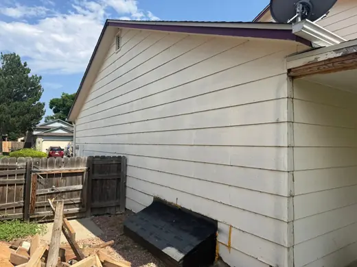 Cream house side with purple trim, before painting, Elements Painting project on the Colorado Front Range