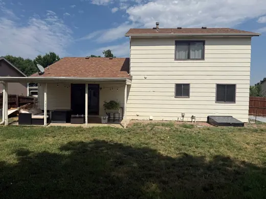 Cream sided house rear with brown roof, Elements Painting project on the Colorado Front Range