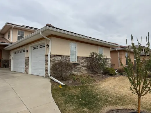 Cream stucco home side yard with tile roof, Elements Painting project on the Colorado Front Range