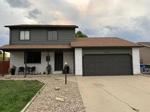 Dark gray home with brown roof and black garage door, Elements Painting project on the Colorado Front Range