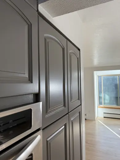 Dark gray pantry cabinet beside window, Elements Painting project on the Colorado Front Range
