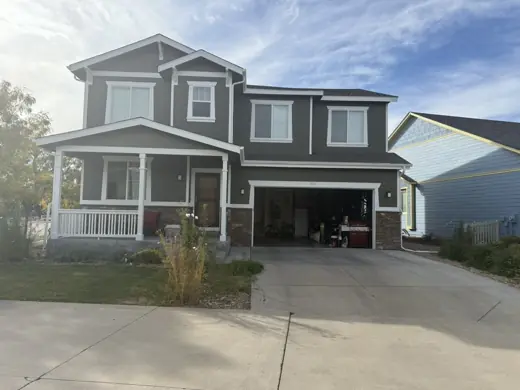 Dark gray two-story home with white trim and garage, Elements Painting project on the Colorado Front Range
