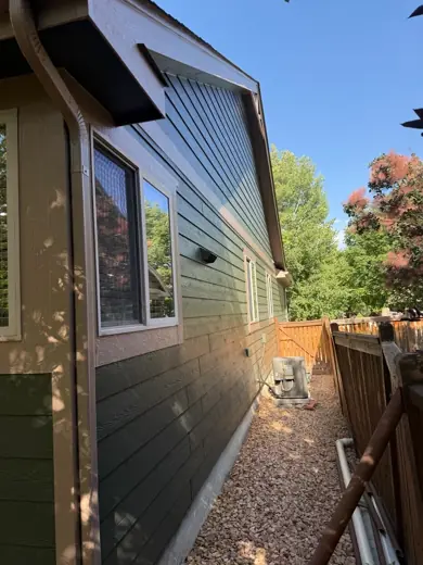 Dark green siding with tan trim, side yard, Elements Painting project on the Colorado Front Range
