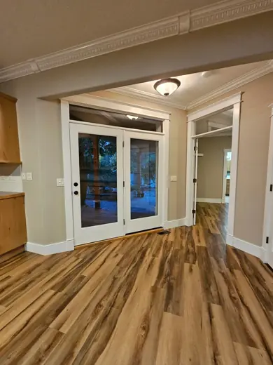 Dining area with gray walls and French doors, Elements Painting project on the Colorado Front Range