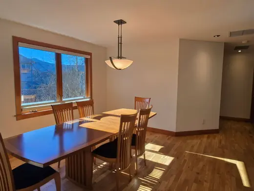 Dining room with mountain view window and warm neutral walls, Elements Painting project on the Colorado Front Range