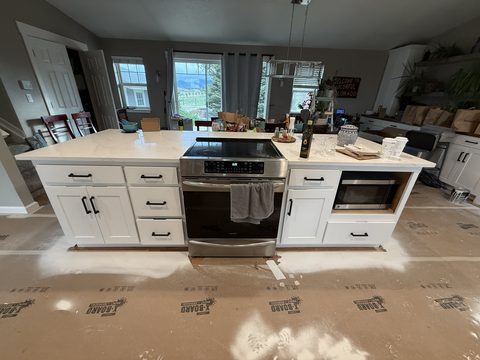 Cabinet painting, white island with range, Elements Painting project on the Colorado Front Range