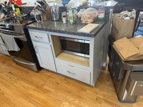 Cabinet painting, light grey island cabinet with microwave opening, Elements Painting project on the Colorado Front Range