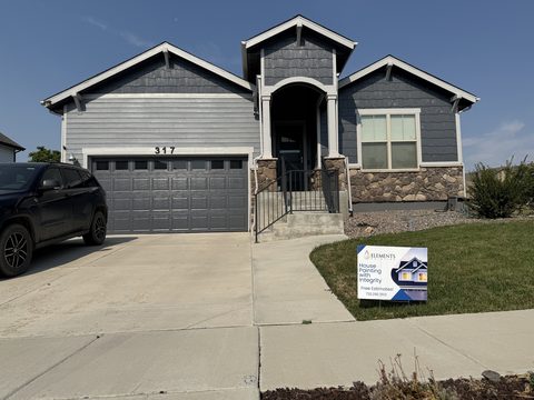 Exterior painting, gray siding and stone front with garage, Elements Painting project on the Colorado Front Range