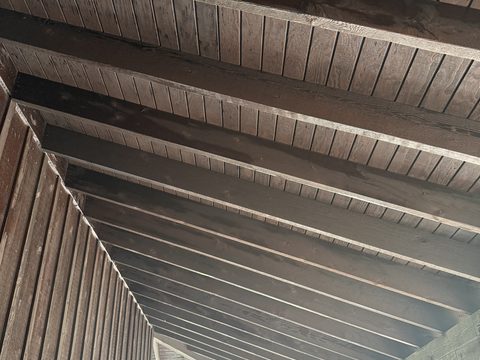Deck and fence staining, underside of stained wood porch rafters and decking, Elements Painting project on the Colorado Front Range