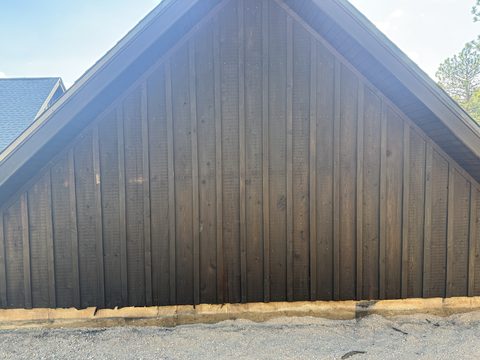 Exterior painting, gable end of dark brown board-and-batten siding, Elements Painting project on the Colorado Front Range