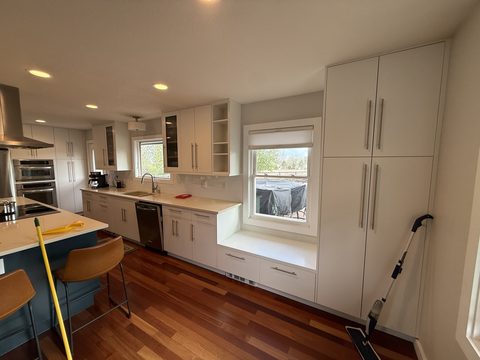 Cabinet painting, white kitchen cabinets, tall pantry, window seat, Elements Painting project on the Colorado Front Range