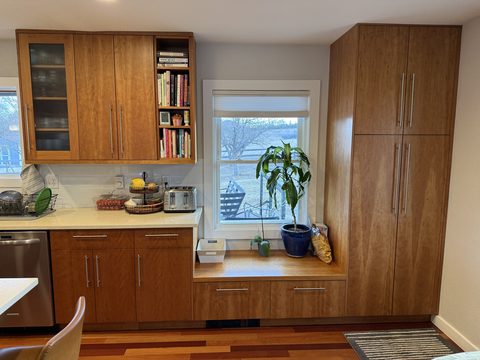 Cabinet painting, kitchen wood cabinets, tall pantry and window seat, cream counters, white walls, Elements Painting project on the Colorado Front Range
