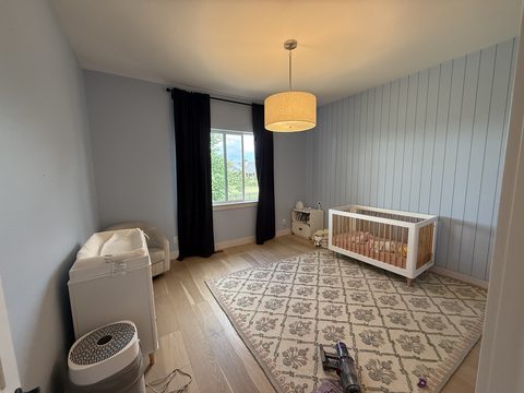 Interior painting, nursery with light blue walls and shiplap accent wall, crib, drum pendant, Elements Painting project on the Colorado Front Range