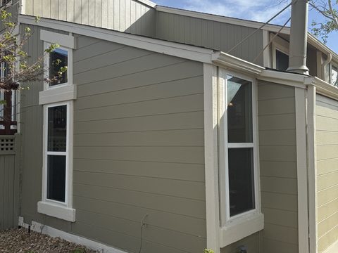 Exterior painting, olive-tan lap siding, crisp white window trim, side addition, light, Elements Painting project on the Colorado Front Range