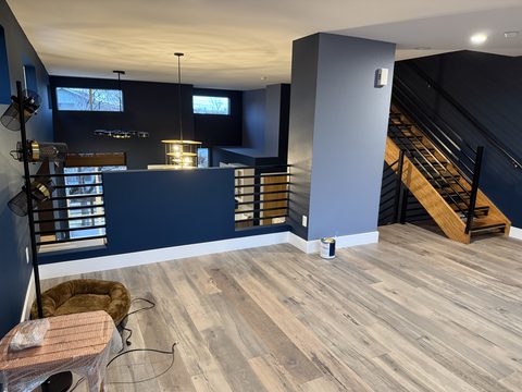 Interior painting, loft landing, navy walls, gray column, metal railing, stairs, Elements Painting project on the Colorado Front Range