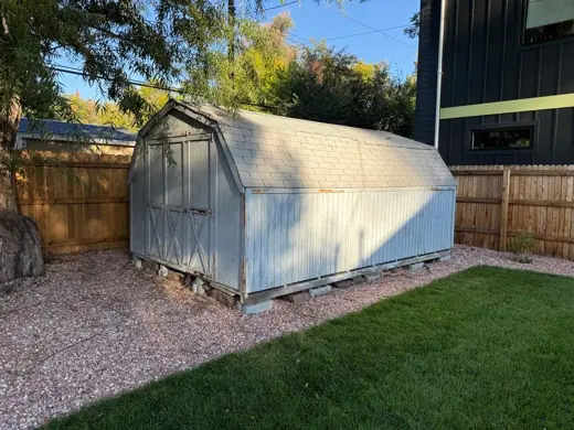 Faded blue shed in backyard before repainting, Elements Painting project on the Colorado Front Range