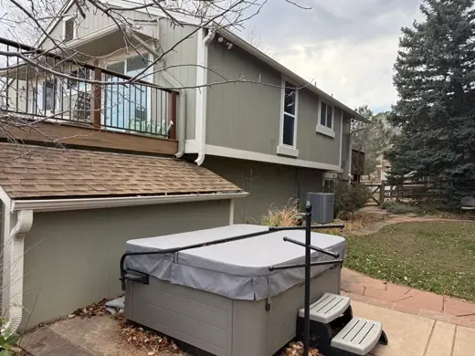 Gray-green home rear with deck and hot tub, Elements Painting project on the Colorado Front Range