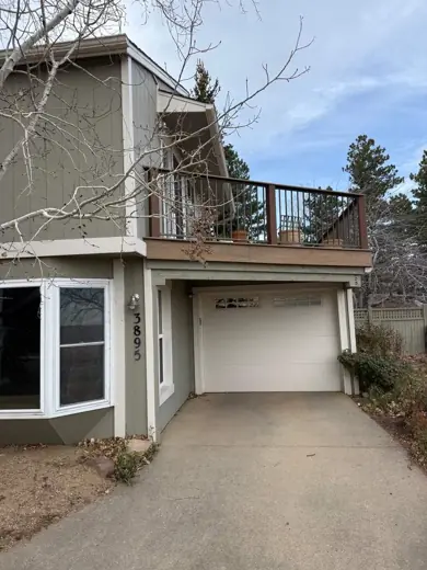 Gray-green home with balcony over garage, cream trim, Elements Painting project on the Colorado Front Range