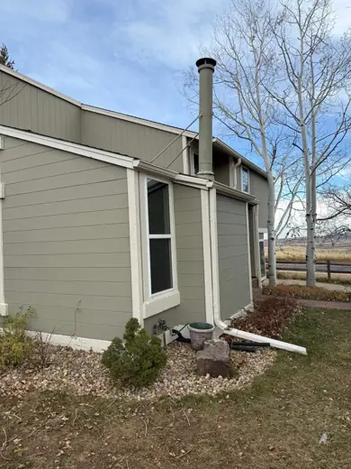 Gray-green siding with dark trim around windows, Elements Painting project on the Colorado Front Range