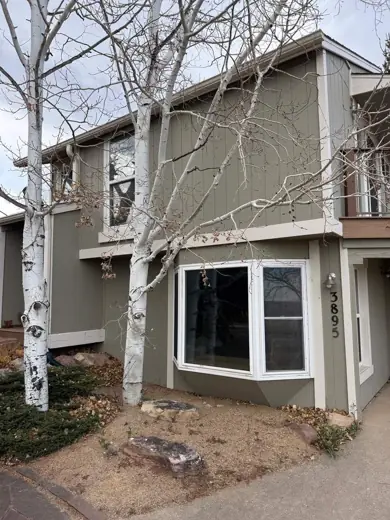 Gray-green two-story home with white trim and windows, Elements Painting project on the Colorado Front Range