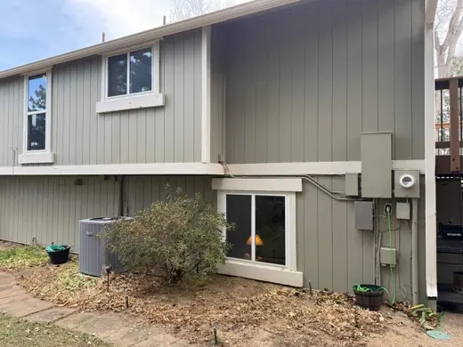 Gray-green two-story house with white trim, Elements Painting project on the Colorado Front Range