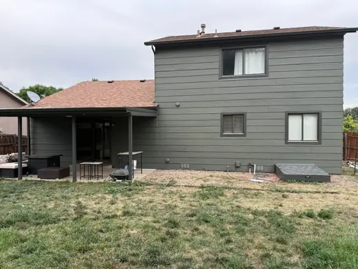 Gray two-story house rear with brown roof, Elements Painting project on the Colorado Front Range