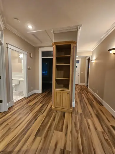 Hallway with gray walls and wood-look flooring, Elements Painting project on the Colorado Front Range