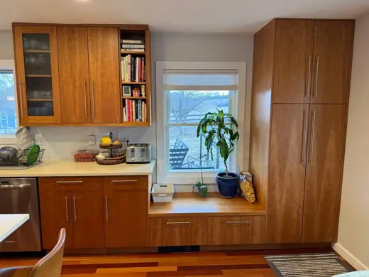 Honey wood cabinets with glass doors, white counters, window, Elements Painting project on the Colorado Front Range