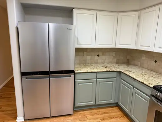 Kitchen cabinets painted white uppers and sage green lowers, Elements Painting project on the Colorado Front Range