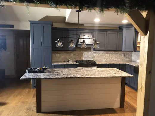 Kitchen island painted dark gray with granite countertop, Elements Painting project on the Colorado Front Range