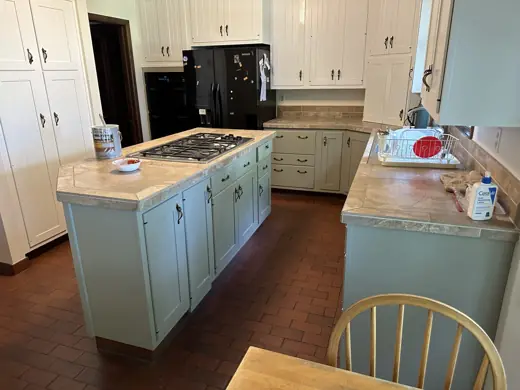 Kitchen with white uppers, sage lower island, dark wood floors, Elements Painting project on the Colorado Front Range