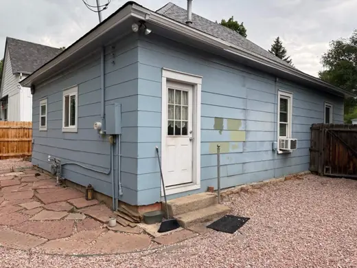 Light blue house side with white trim, patio, Elements Painting project on the Colorado Front Range