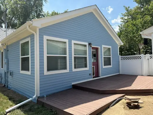 Light blue house with white trim and new deck, Elements Painting project on the Colorado Front Range