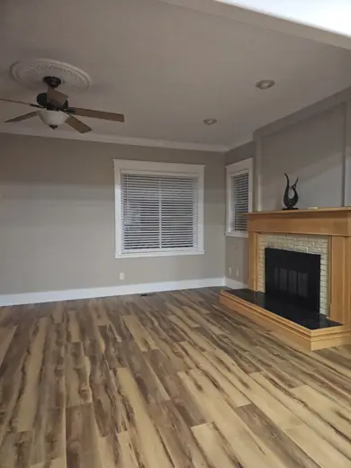 Living room with gray walls, fireplace and wood floors, Elements Painting project on the Colorado Front Range