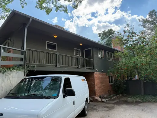 Olive-green home with brown deck and van, Elements Painting project on the Colorado Front Range