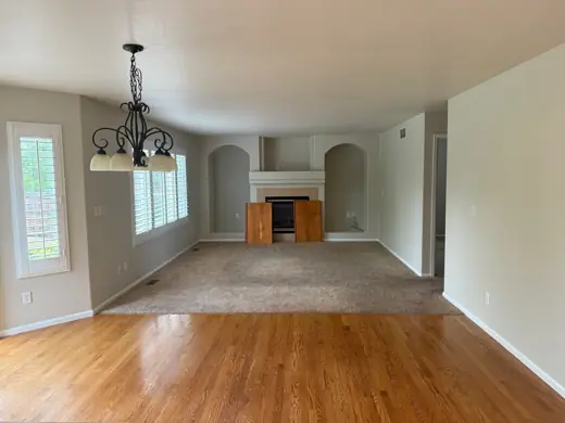 Open living area with hardwood floors and greige walls, Elements Painting project on the Colorado Front Range