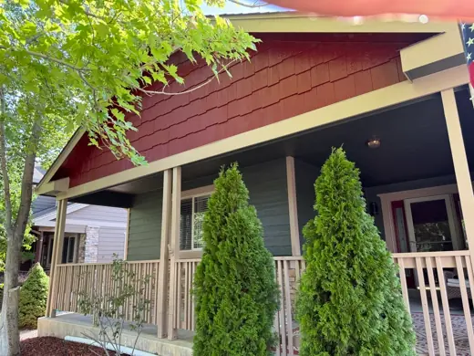 Red and green craftsman home with covered porch, Elements Painting project on the Colorado Front Range