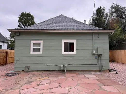 Sage green house rear with white window trim, Elements Painting project on the Colorado Front Range