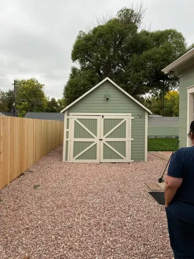 Sage green shed with white barn door, gravel, Elements Painting project on the Colorado Front Range