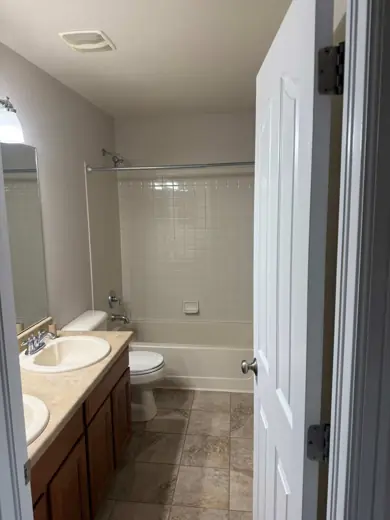 Small bathroom with white walls, vanity and tub surround, Elements Painting project on the Colorado Front Range