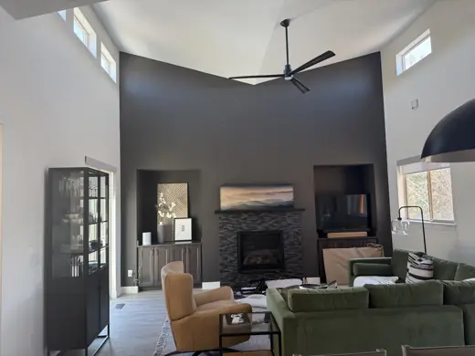 Two-story great room with dark accent walls and fireplace, Elements Painting project on the Colorado Front Range