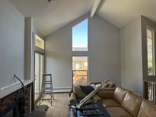 Vaulted living room with ladder and prep for painting, Elements Painting project on the Colorado Front Range