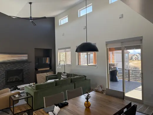 Vaulted living space with dark trim windows and dining area, Elements Painting project on the Colorado Front Range